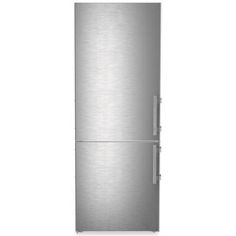 a silver refrigerator freezer sitting on top of a white wall