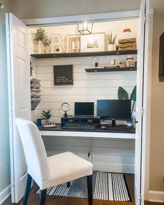 a desk with two computers on it in a room