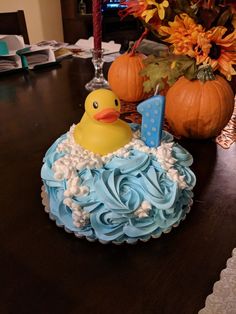 a cake shaped like a rubber ducky on top of a table