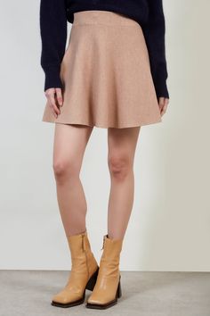 Shop For Beige Shaped Knit Mini Skirt At Glassworks London. Free Uk Shipping For Orders Over £75. Buy Now Pay Later With Klarna. | Fit: True To Size | Care: Gentle Wash Cold And Dry In Shade | Lining: None | Stretch: Low | Thickness: Moderate | Sheerness: None | Materials: 80% Acrylic, 20% Polyester | Measurements: 1. Waist: 30cm, 2. Length: 42cm Casual A-line Mini Skirt For Winter, Chic Beige Stretch Mini Skirt, Chic Beige Mini Skirt For Winter, Trendy Beige Mini Skirt For Winter, Chic Beige Winter Mini Skirt, Trendy Beige Winter Mini Skirt, Beige Fitted Mini Skirt For Fall, Beige Flared Skirt For Winter, Beige Mini Skirt For Fall