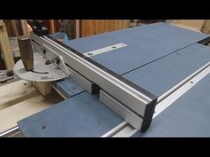 a table saw is being used to cut wood