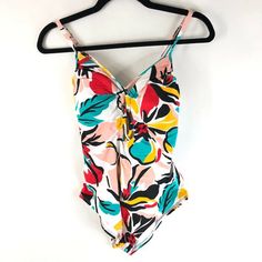 Beach Betty By Miracle Brands One Piece Swimsuit Floral Colorful White M New With Tags! Armpit To Armpit: 12.5" Length: 26.5" Comes From A Smoke Free Home. Feel Free To Ask Any Questions You May Have. Thanks For Looking! Beachy Multicolor V-neck Swimwear, Multicolor One-piece Swimwear With Tropical Print, Beachy V-neck Multicolor Swimwear, Casual Multicolor One-piece Swimwear, Casual Multicolor Floral Print Swimwear, Colorful Sleeveless Swimwear For Vacation, Colorful Sleeveless Swimwear For Spring, Casual Multicolor Tropical Print Swimwear, Casual Multicolor Swimwear With Vibrant Print