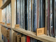 the shelves are filled with records and cds