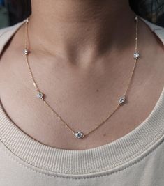 This is a beautiful diamond by the yard necklace with Lab Grown Diamonds. It has 5 diamonds set in real solid 14Kt Gold. You can choose if you want 14Kt White Gold, 14Kt Yellow Gold or 14Kt Rose Gold.  We have a lot of beautiful jewelry with natural diamonds.  If any listing states "diamond" then it is a natural diamond. If the listing states "Lab Grown" it is a Lab Grown diamond. This is the perfect gift for mom, wife, fiancee, girlfriend, valentine, daughter, family or friend. It is a special gift for mother's day, valentine's day, wedding, anniversary, birthday, Christmas, Easter, New Year's and any holiday. Total Diamonds: 7 Each diamond is 0.25 Ct 1.75 Ct Total Diamond Weight Clarity: VS-SI Color: FG Color 3.56 Grams  4.75 mm Bezel Size 0.030 inch Chain Width 18 inch chain (if you nee Diamond By The Yard, Gold Diamond Necklace, Perfect Gift For Mom, 14kt Gold, Mother Day Gifts, Lab Grown, Lab Grown Diamonds, Favorite Jewelry, Natural Diamonds