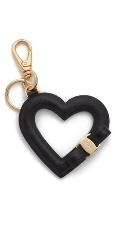 a black heart shaped keychain on a gold plated metal hook with a clip