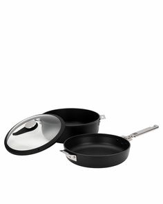 two black pans sitting next to each other