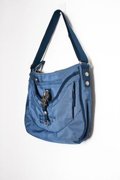 Blue George Gina & Lucy bag with adjustable strap (can be worn as a crossbody or on the shoulder). This item is preloved but in 9/10 condition with only light scratches on the hardware.  Bag dimensions: 32 x 28 x 8cm (12.5" x 11" x 3") Strap drop: 27-57cm (10.5" - 22") Functional Blue Bags With Detachable Strap, Functional Blue Crossbody Shoulder Bag, Functional Blue Bag With Adjustable Strap, Blue Travel Shoulder Bag With Detachable Strap, Blue School Shoulder Bag With Adjustable Strap, Blue Shoulder Bag With Detachable Strap For Travel, Blue Travel Shoulder Bag With Zipper Closure, Blue Shoulder Bag With Zipper For Travel, Blue Shoulder Bag With Zipper Closure For Travel