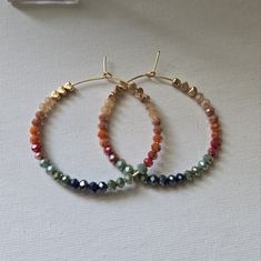 An Array Of Fall Colored Beads With Gold Tone Heart Beads. 2 Inch Hoops. Handmade Orange Hoop Earrings With Colorful Beads, Orange Hoop Earrings With Colorful Beads For Gift, Fall Beaded Earrings, Fall Beaded Jewelry, Ballerina Earrings, Fall Bead, Minnie Mouse Earrings, Stud Fashion, Boho Style Earrings