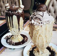 two desserts sitting on plates next to each other