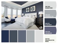 a bedroom with blue walls, white bedding and gray carpeted flooring is featured in this color scheme