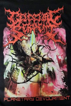 a black shirt with an image of a giant spider crawling on it's back