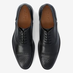 The Noah Shoe: a TAFT original, this well-made oxford brogue is crafted from the finest Spanish calfskin and black leather. With a classic captoe silhouette and a split leather sole, this stylish dress shoe will last a lifetime. UPPER: Spanish Calfskin OUTSOLE: Leather sole Brogue captoe design Standard D Width Blake Construction (resoleable) Handcrafted in Spain Note: Take precautions to avoid wet conditions while wearing our leather-soled shoes. Color transfer onto carpets, fabrics, and uphols Fitted Oxfords With Round Toe For Semi-formal Occasions, Fitted Lace-up Shoes With Leather Lining And Almond Toe, Fitted Goodyear Welted Oxfords For Semi-formal Occasions, Formal Lace-up Shoes With Goodyear Welt And Cap Toe, Formal Lace-up Shoes With Goodyear Welted Cap Toe, Classic Fitted Oxford Lace-up Shoes, Semi-formal Fitted Goodyear Welted Oxfords, Cap Toe Oxfords For Derby, Fitted Cap Toe Oxfords For Derby