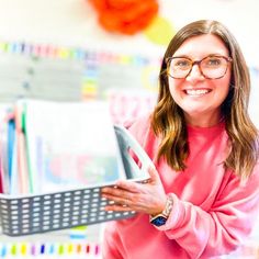 a woman wearing glasses is holding a basket