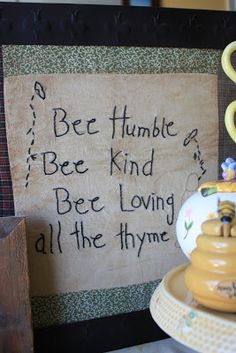 a sign that says bee humble bee kind be loving all the time