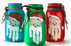 three painted mason jars with santa's handprints on them and the words, day 25 handprint art santa jar by free kids crafts