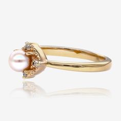 Sometimes simple and sweet is the most elegant choice. A gleaming cultured pearl measuring 4.5mm sits atop this lovely 14k yellow gold ring. Accented with four small round natural diamonds for a total diamond weight of 0.04ct. Delicate Yellow Gold Pearl Ring With Diamonds, Delicate Yellow Gold Pearl Ring, Classic Yellow Gold Pearl Ring With Single Diamond, Elegant 14k Gold Pearl Ring With Single Diamond, Classic Yellow Gold Pearl Ring With Diamond, Yellow Gold Pearl Diamond Ring With Accents, Classic Gold Pearl Ring With Diamond, Classic Gold Pearl Ring With Halo Setting, Elegant Yellow Gold Pearl Ring With Halo