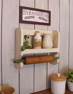 a shelf that has some items on it and a potted plant next to it