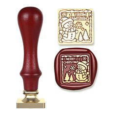 a rubber stamp with a christmas scene on it and a wooden stamper next to it