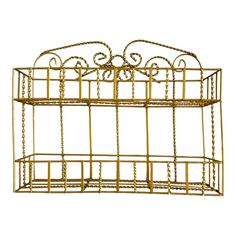 a gold metal shelf with chains hanging from it's sides