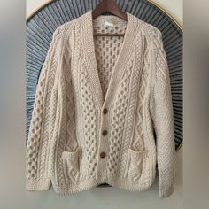 Vintage! Known In Ireland As A Lumber Jacket This Is A V Neck Cardigan. 6 Buttons (Two Missing, See Images) And 2 Traditional Front Pockets. The Women Who Knit These Sweaters Come From A Long Line Of Family Members Who Have Knit Sweaters Like This For Their Own Families For Generations. This Is A Celtic Honeycomb Wool Cardigan Sweater. This Sweater Features Two Pockets In Front With Aran Traditional Patterns. The Sweaters Are Chunky And Will Keep You Very Warm And Will Last For Decades If Cared For Properly. Flaw! Missing The First And Last Button. I Did Not Replace Them Since I Did Not Want To Take Away From The Authenticity Of The Sweater. Truly Does Not Affect The Functionali Aran Cardigan, Celtic Heritage, Knit Sweaters, V Neck Cardigan, Wool Cardigan, Lumber, Honeycomb, Family Members, Cardigan Sweater