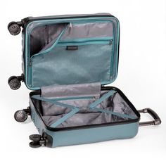 an open suitcase sitting on top of a white floor next to a black and blue handle