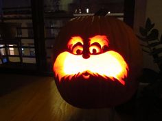 a pumpkin with a face carved into it