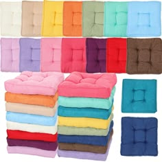 many colors of towels stacked on top of each other in different shapes and sizes,