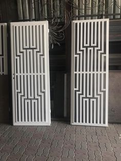 two white doors sitting next to each other