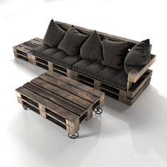 a couch made out of wooden pallets sitting on top of a white floor next to a coffee table