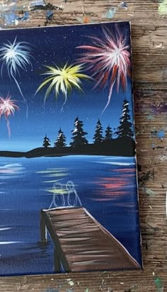 a painting of fireworks on the water with trees in the background