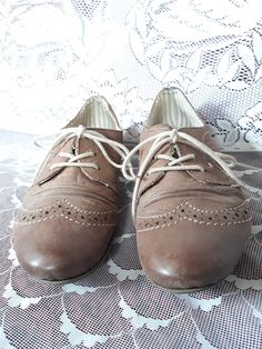 "Cappuccino brown leather women`s wingtip lace up flat heels shoes. Leather sneakers. Decorative perforated and wrinkled front. Size 36 EU. brand: Rieker (Germany shoemaker company) condition: has some slight signs of wear. Look at the photos. Heels height 0.6\" in / 1,5 cm Outsole length- 10.3\" in / 26,5 cm bottom sole width in widest place 3\" in / 7,8 cm SIZE: labeled 36 EU size; Estimated is 36 EU. US 5.5." Brown Wingtip Lace-up Oxford Shoes, Brown Lace-up Shoes With Brogue Detailing, Brown Wingtip Oxfords With Laces, Brown Almond Toe Lace-up Shoes With Brogue Detailing, Vintage Low-top Lace-up Shoes With Brogue Detailing, Vintage Brogue Low-top Lace-up Shoes, Vintage Brogue Lace-up Low-top Shoes, Classic Brown Lace-up Shoes With Low Heel, Brown Oxfords With Round Toe And Laces