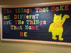 a bulletin board with winnie the pooh on it and some words written in different colors