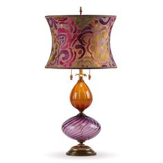 a lamp that is sitting on top of a wooden base with a pink and orange shade