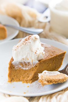 a slice of pumpkin pie with whipped cream on top