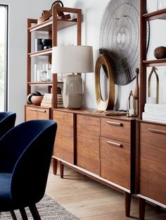 a living room filled with furniture and a large window