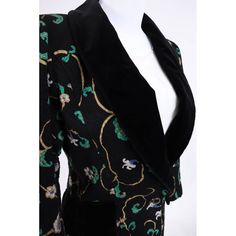 Description: 1990's Ungaro Black Floral Patterned Jacket with Velvet Detail This smoking hot jacket immediately became a shop fave as soon as we saw it on. The cotton floral fabric is gorgeous and the cut is super flattering. Our model said it was really comfortable and she had a blast wearing it We love the gorgeous 90's silhouette with its broad shoulders and tapered hips. Velvet decorative hip pockets are perfectly placed and the plunging velvet neckline lends itself to lots of jewelry layeri Fitted Silk Blazer With Floral Print, Fitted Floral Print Winter Blazer, Fitted Floral Print Blazer For Winter, Fitted Vintage Blazer With Floral Print, Vintage Fitted Floral Print Blazer, Fitted Vintage Floral Print Blazer, Patterned Jacket, Lots Of Jewelry, 90s Jacket