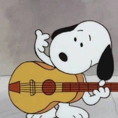 a cartoon dog holding a guitar and playing it