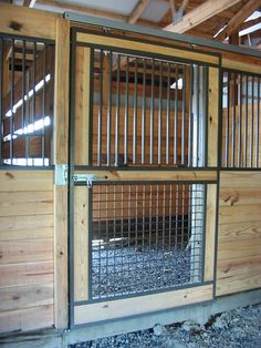 the inside of a wooden building with metal bars