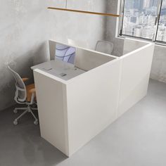 an office cubicle with a desk and chair in front of a window overlooking the city