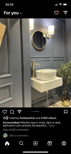 the bathroom is decorated in gray and gold