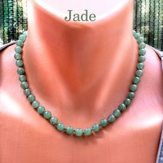 Elevate your style with this exquisite Jade Necklace, featuring about 8mm round gemstone beads. Crafted with precision and care, each bead showcases the natural beauty and unique patterns of jade, making every piece one-of-a-kind. The necklace is expertly tied on a green thread with knots between the beads and finished with a secure clasp, ensuring both elegance and durability. Add a touch of sophistication to any outfit with this timeless jade jewelry. Necklace length 18 in + 2 in Extender /up Jade Gemstone Beaded Necklaces With Round Beads, Jade Gemstone Beaded Necklace With Round Beads, Elegant Jade Beaded Necklace With 8mm Beads, Beaded Jade Necklaces With Gemstone Beads, Jade Beaded Necklaces With Gemstone Beads, Jade Beaded Necklace With Gemstone Beads, Jade Beaded Necklaces With 8mm Round Beads, Jade Beaded Necklaces With 8mm Beads, Jade Jewelry Necklace