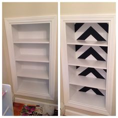 two white bookshelves with black arrows painted on the top and bottom, one is empty