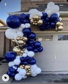 blue and gold balloon arch in front of a house