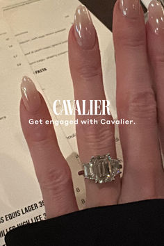 a close up of a person's hand with a ring on it and the caption cavalier get engaged with covalier