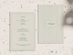 the wedding stationery is laid out on the table