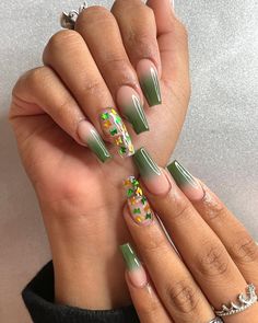 Olive green ombre nails combine the best of both worlds – a natural-looking color that goes well with almost any outfit, and the popular ombre nail design style that adds some contrast to your manicure and makes it look super stylish. Ombre Nail Designs Green, Coffin Nail Ideas Green, Olive Ombre Nails, Olive Green And White Nails, Coffin Green Nails, Olive Green Ombre Nails, Purple And Green Ombre Nails, Green Ombre Acrylic Nails