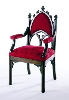 a red and black chair sitting on top of a white floor