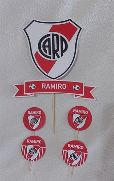 an image of badges and stickers on a white shirt with the word ramiro