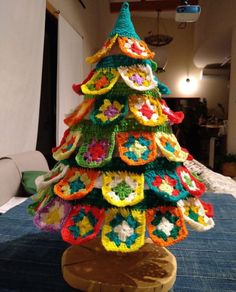 a crocheted christmas tree sitting on top of a table