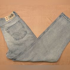 Levi's Silvertab Denim Jeans. Embrace The Distressed Style With Shades Of Blue And Light Fabric Wash That Gives A Vintage And Rugged Look. These Jeans Feature A High-Rise Waist With A Loose Fit Through The Seat And Thigh Crafted From 100% Cotton With A Tapered Leg, These Jeans Are Machine Washable, Making Them Ideal For Regular Use. Levi's Light Wash Rigid Denim Jeans, Levi's Distressed Casual Jeans, Levi's Casual Distressed Jeans, Levi's Distressed Light Wash Jeans, Levi's Light Wash Distressed Jeans, Casual Faded Levi's Jeans, Casual Levi's Faded Jeans, Levi's Faded Denim Bottoms, Faded Levi's Denim Bottoms